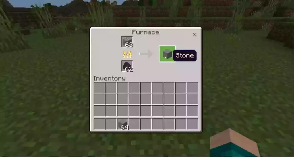 Smelting cobblestone into regular stone as the first step of how to make smooth stone in Minecraft